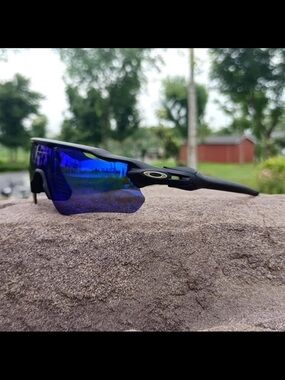 Oakley Black Frame Sunglasses with Blue Mirrored Lens and other lenses